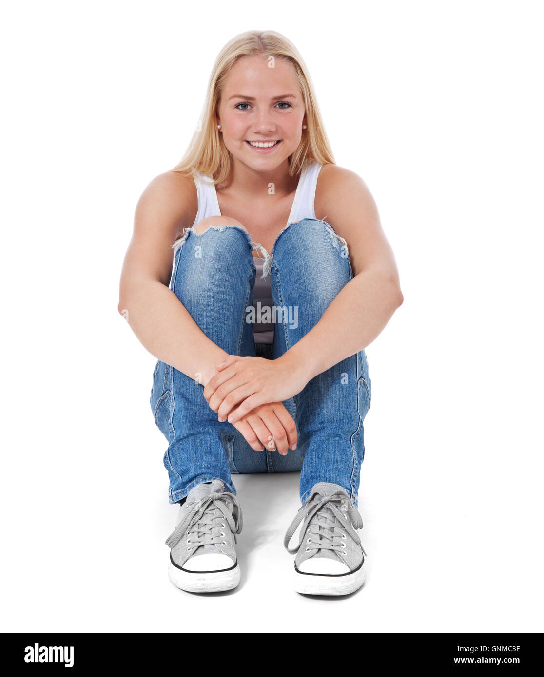 Girl sitting on the floor Stock Photo - Alamy