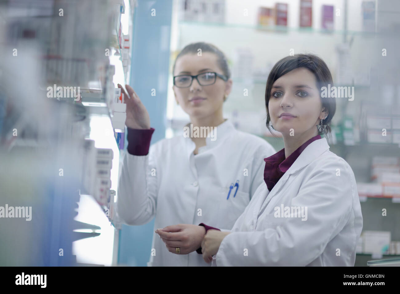 team of pharmacist chemist woman in pharmacy drugstore Stock Photo - Alamy