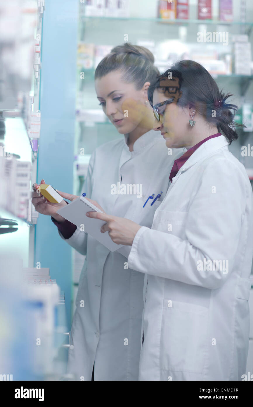 team of pharmacist chemist woman in pharmacy drugstore Stock Photo - Alamy
