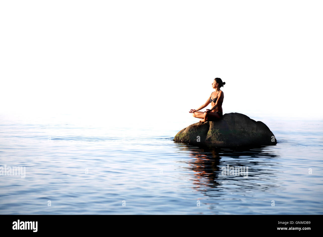 Yoga In The Sea Stock Photo