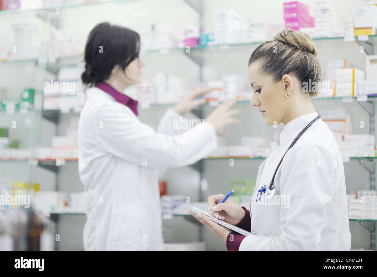 team of pharmacist chemist woman in pharmacy drugstore Stock Photo - Alamy