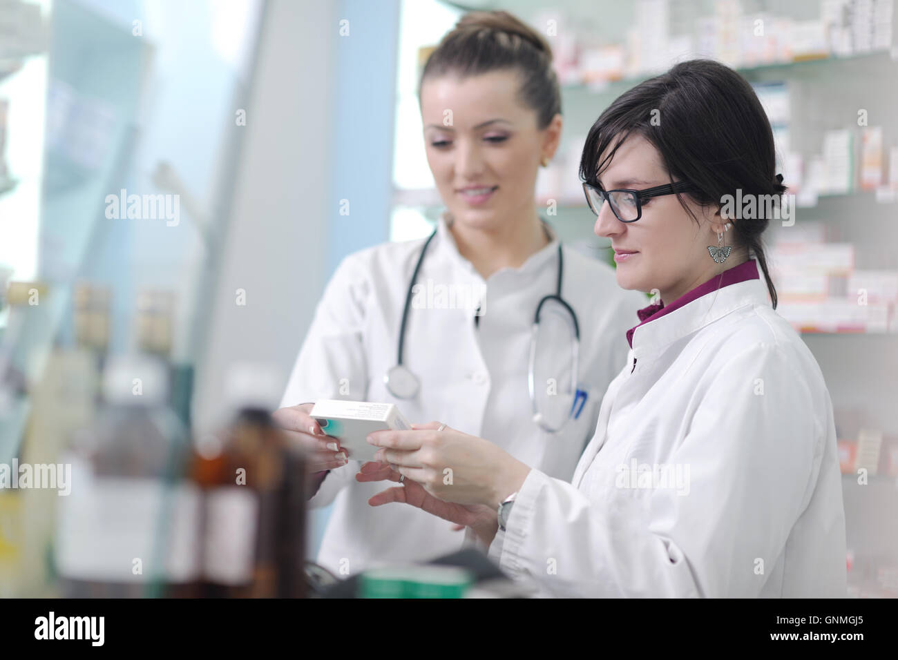 team of pharmacist chemist woman in pharmacy drugstore Stock Photo - Alamy