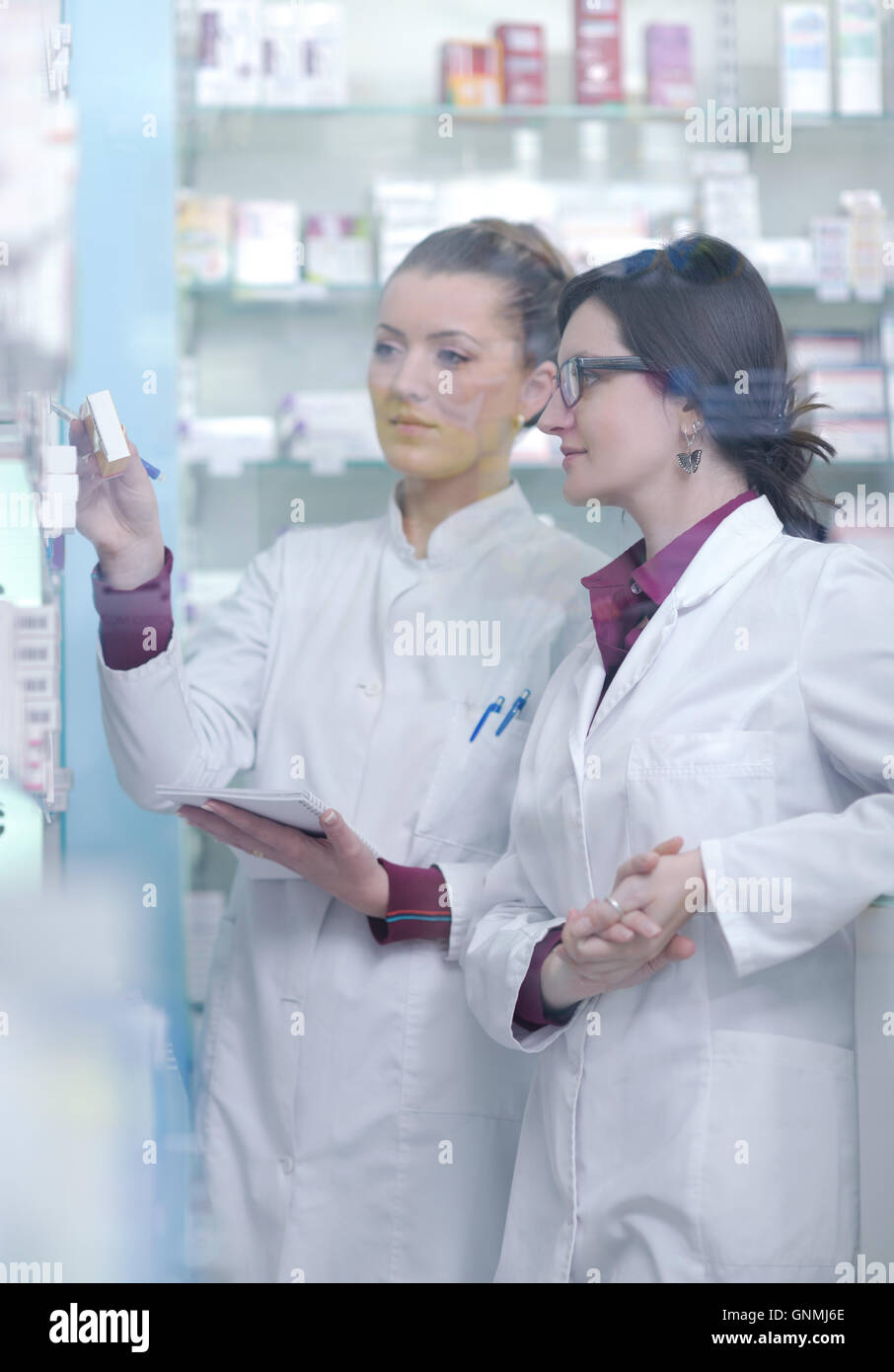 team of pharmacist chemist woman in pharmacy drugstore Stock Photo - Alamy