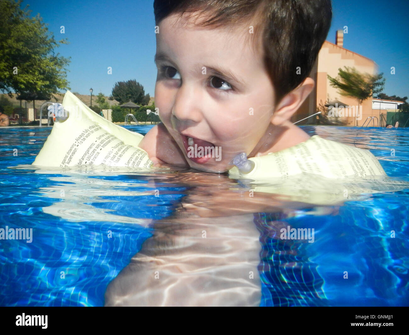 Boy swimming in a pool Stock Photo Alamy