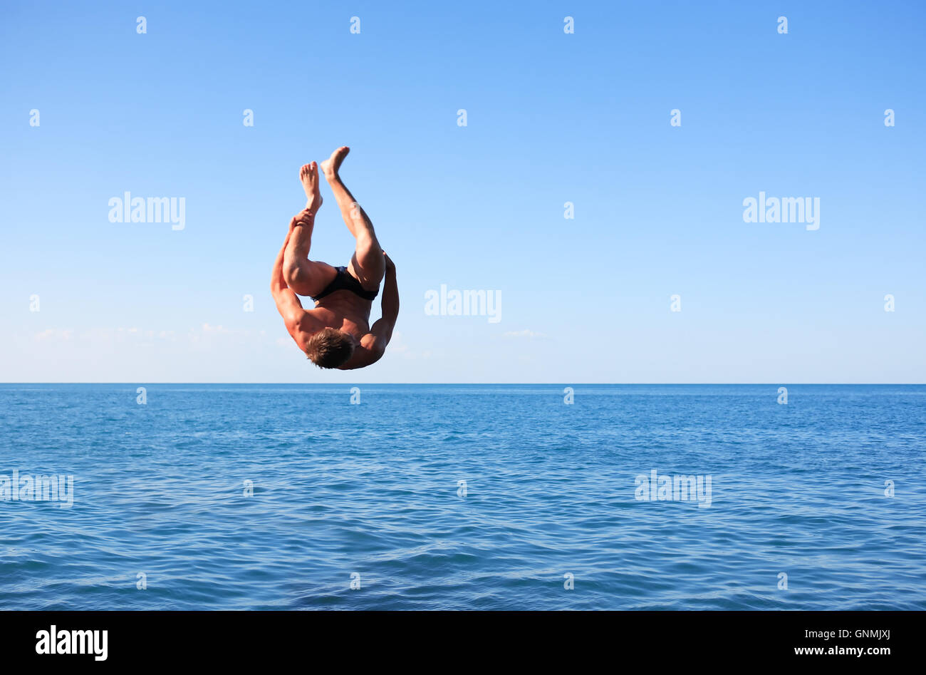 Somersault Above Sea Stock Photo - Alamy