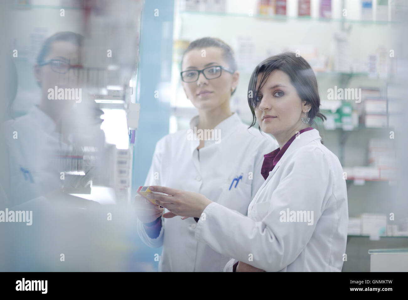 team of pharmacist chemist woman in pharmacy drugstore Stock Photo - Alamy