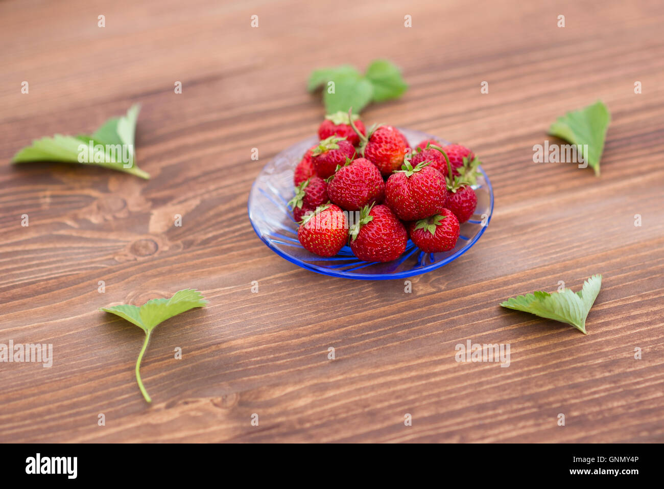 bright, juicy and ripe strawberry on a light background Stock Photo - Alamy