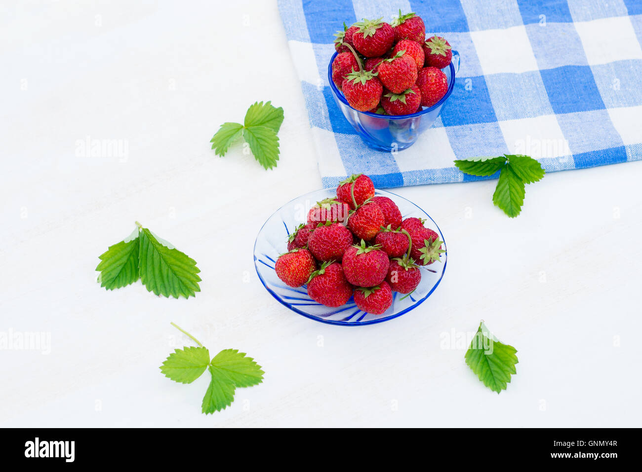 bright, juicy and ripe strawberry on a light background Stock Photo - Alamy