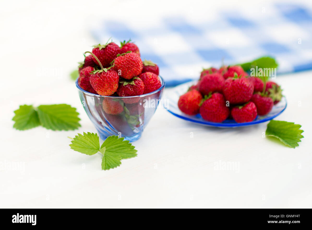 bright, juicy and ripe strawberry on a light background Stock Photo - Alamy