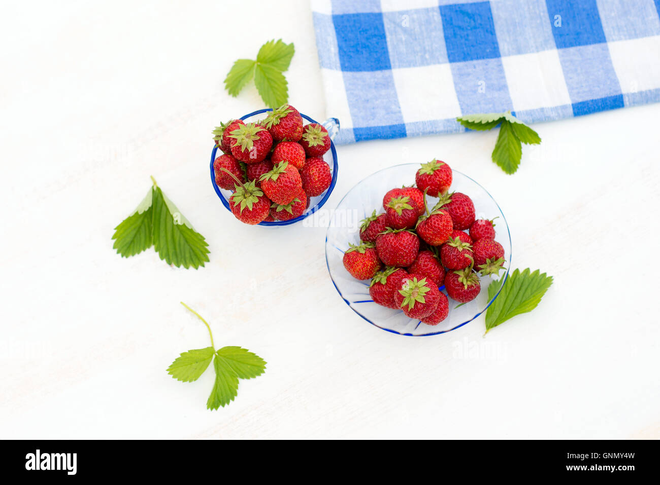 bright, juicy and ripe strawberry on a light background Stock Photo - Alamy