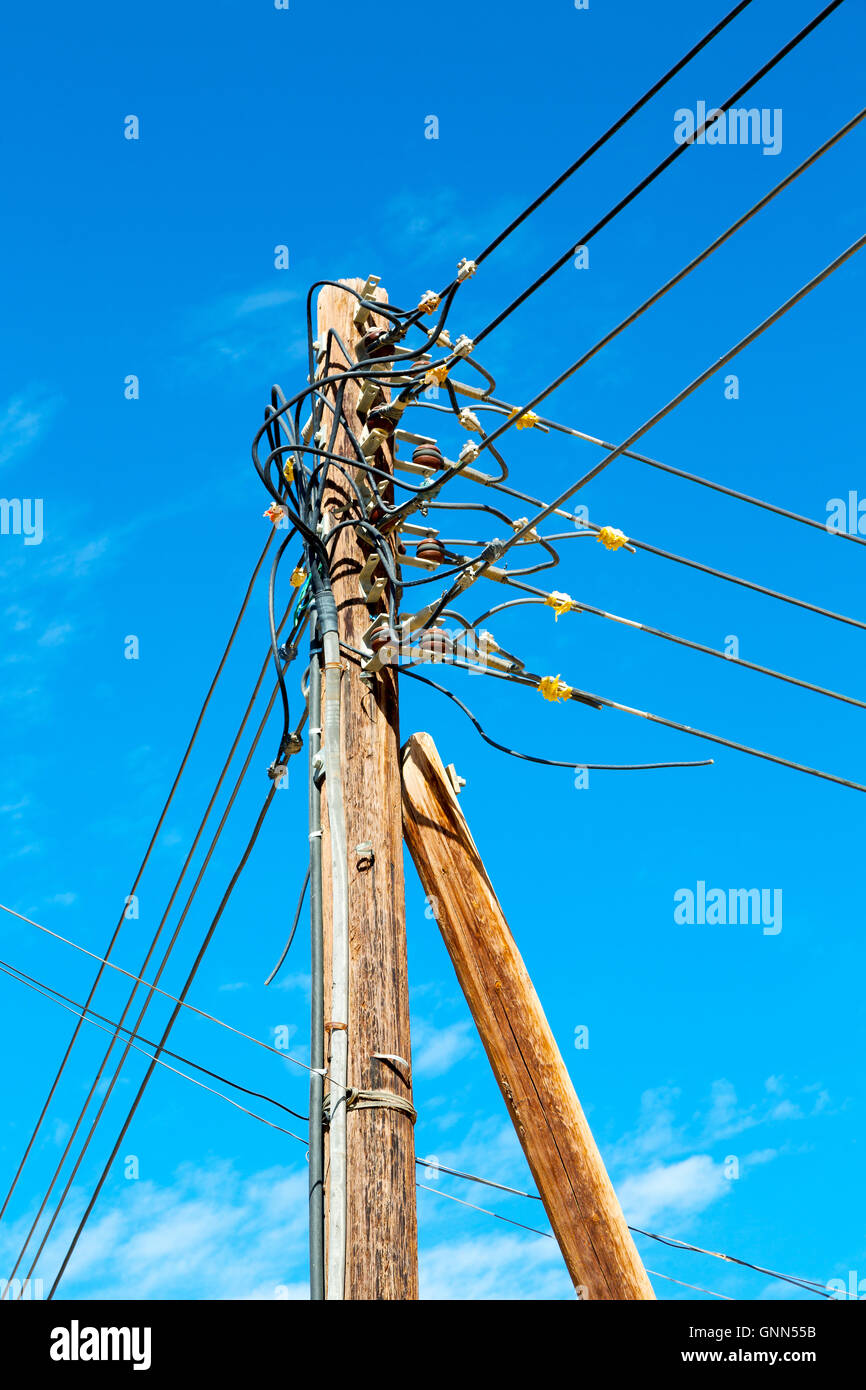 wood pylon energy and current line in oman the electric cable Stock