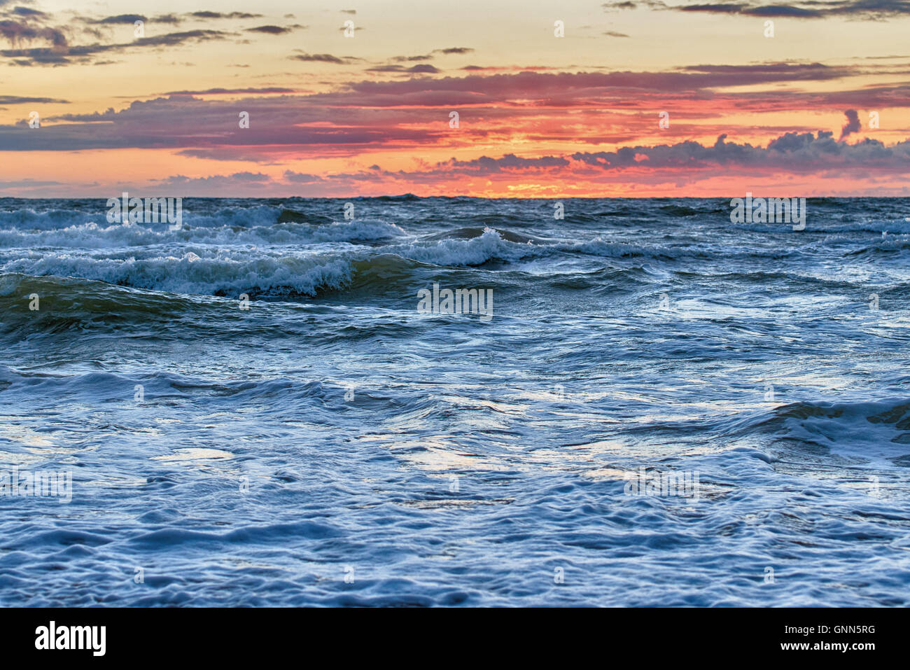 Sunset At The Stormy Sea Stock Photo