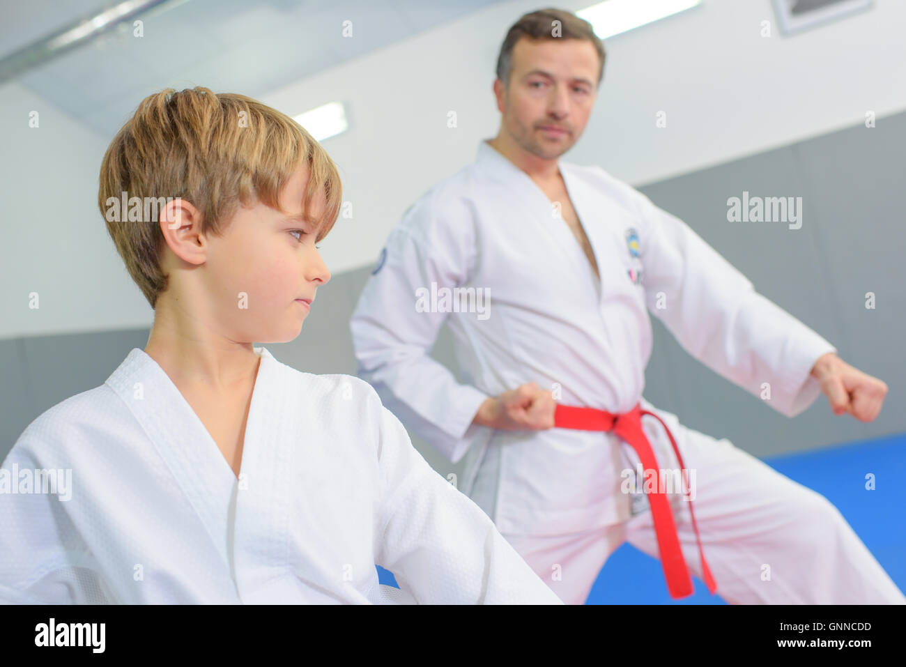 Young boy in a martial arts lesson Stock Photo Alamy