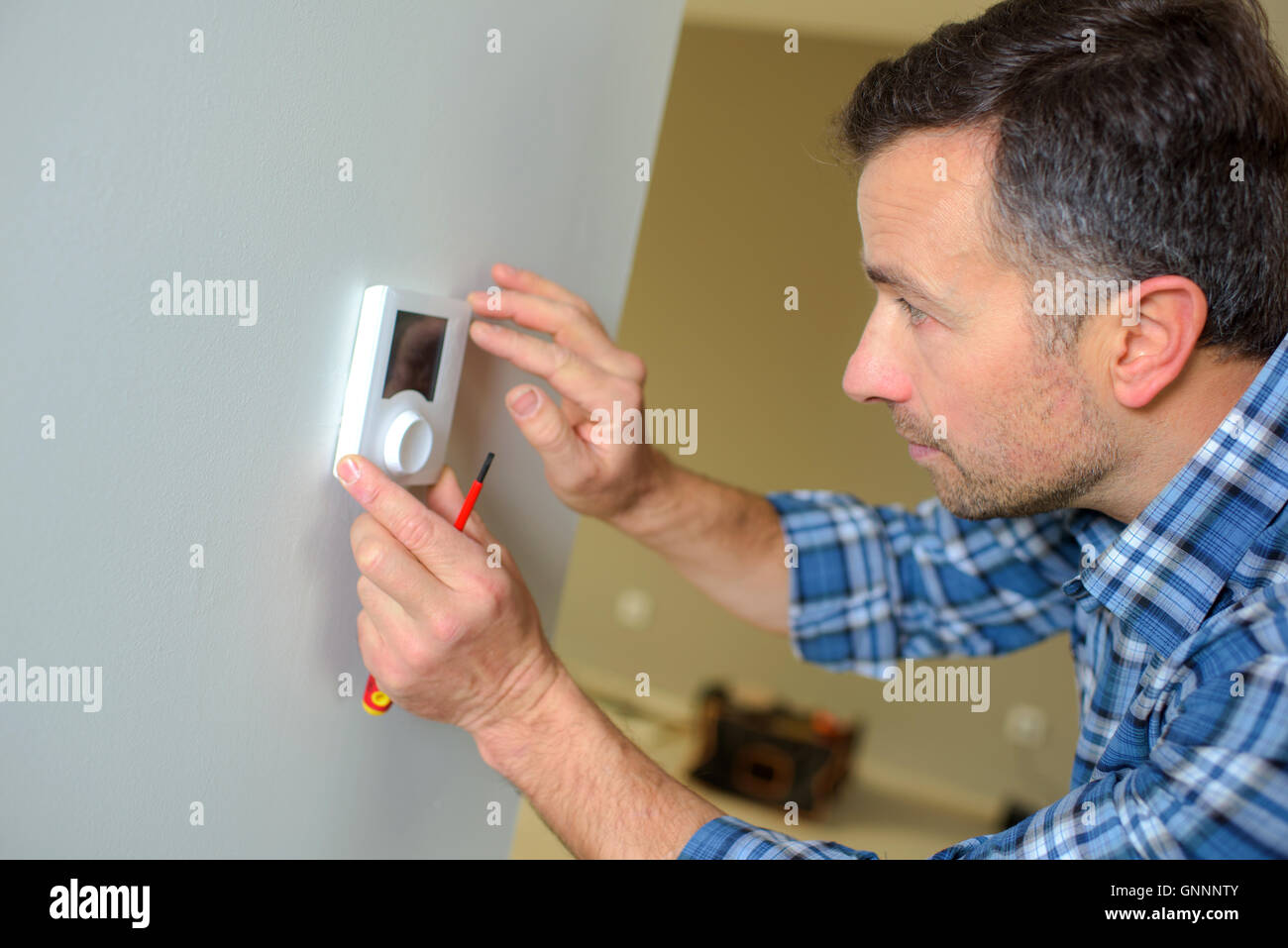Fitting a thermostat Stock Photo Alamy