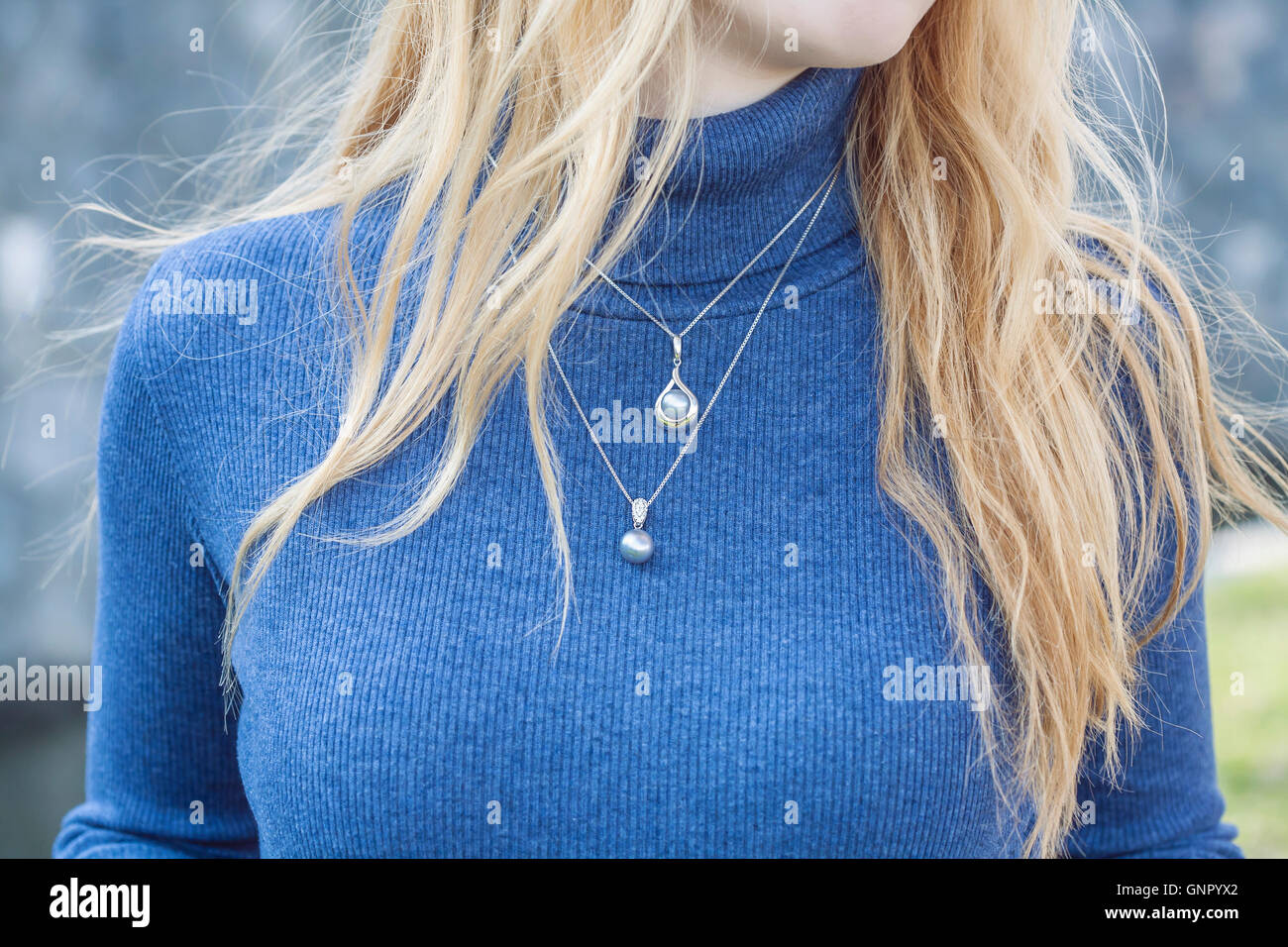 Girl wearing pearl necklace hi-res stock photography and images - Alamy