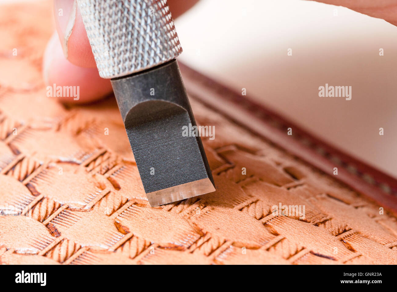 leathercrafting blade of swivel knife carving pattern on leather