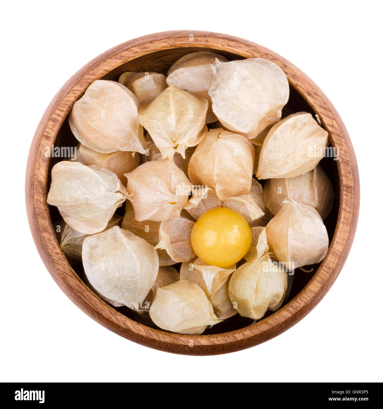 Physalis in a wooden bowl on white background. Edible ripe fruits of Physalis peruviana, a plant in the nightshade family. Stock Photo