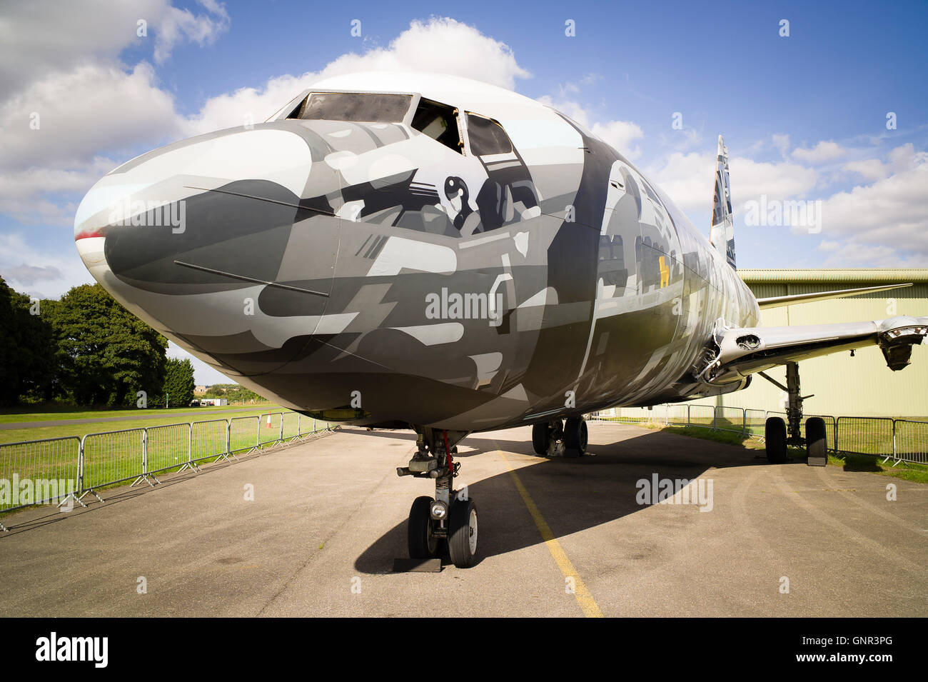 A retired civil airliner painted by art students as a project prior to dismantling Stock Photo