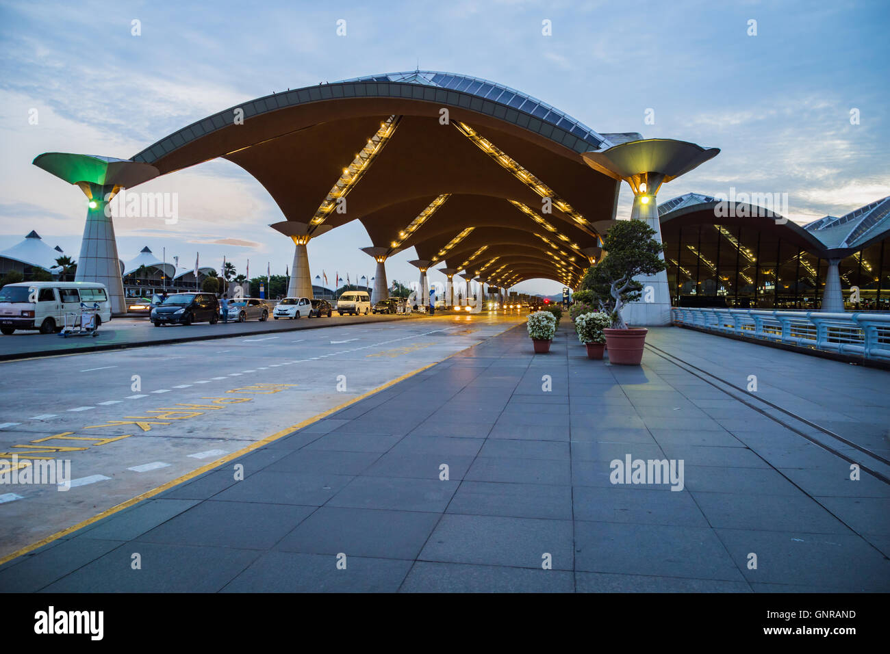 Kuala Lumpur, Malaysia - circa August 2016: Kuala Lumpur International Airport - exterior, architecture of departure terminal Stock Photo
