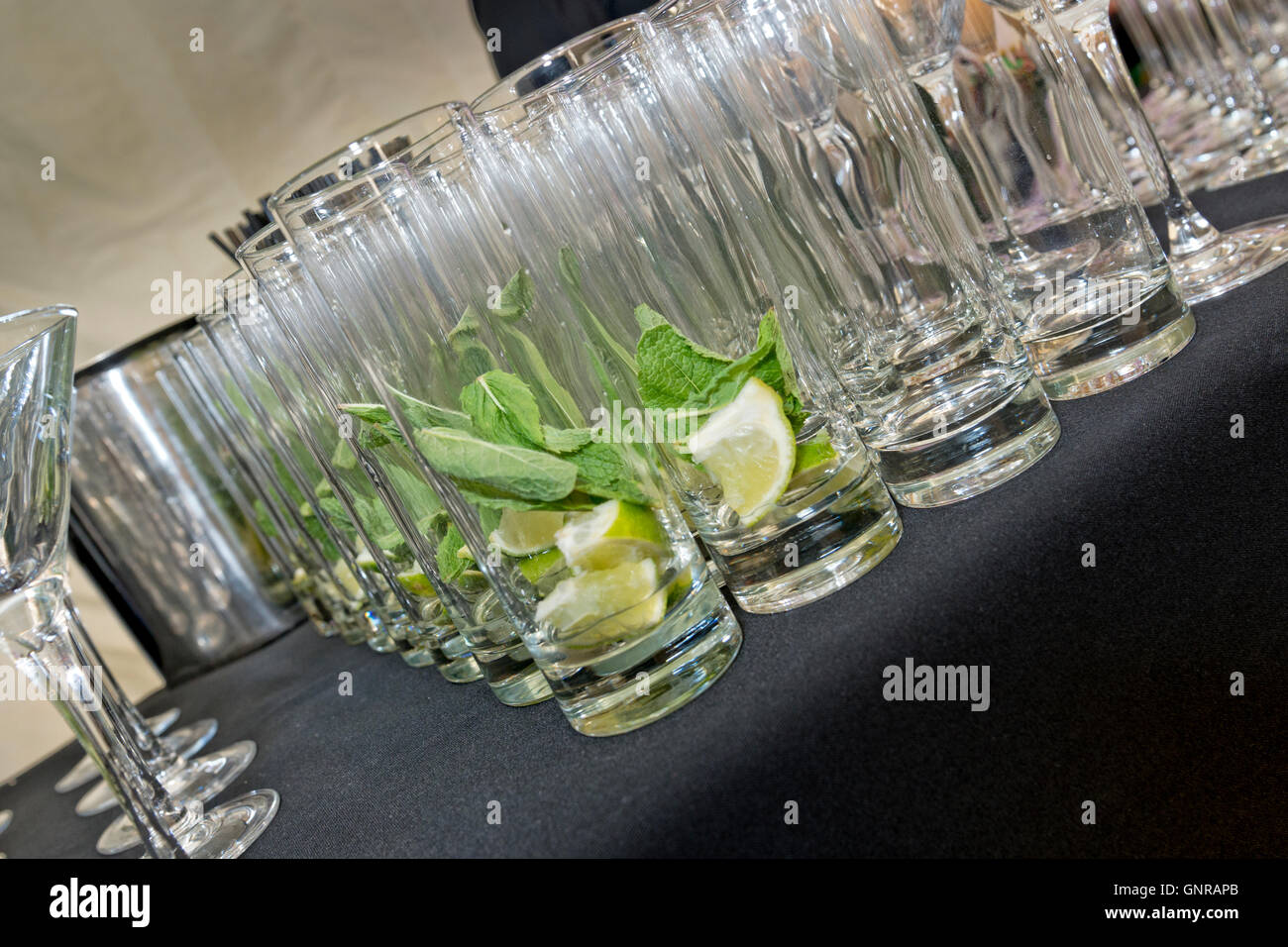 Drinks glasses prepared for serving at a private party Stock Photo