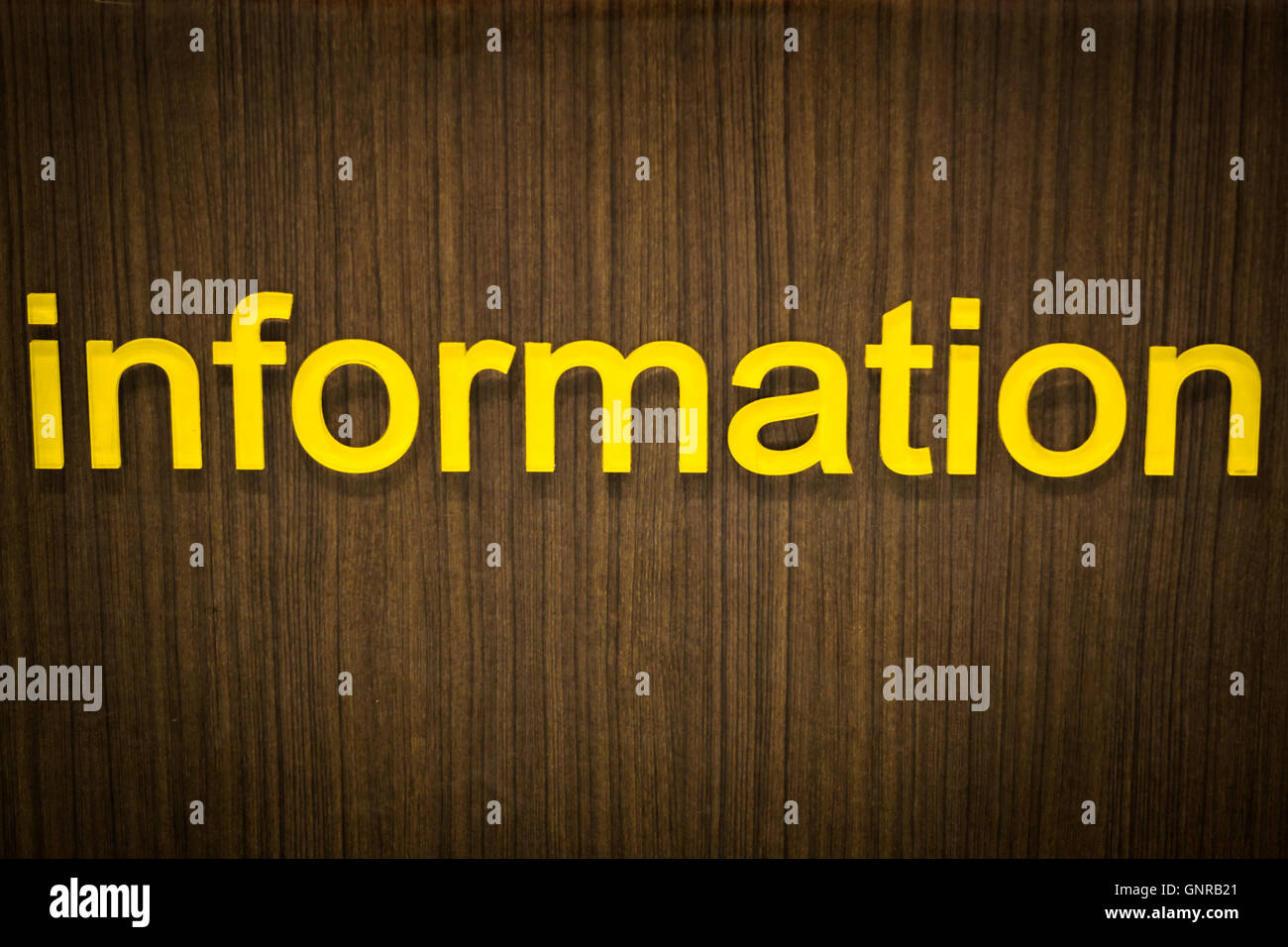 information letter sign or label on wooden wall Stock Photo