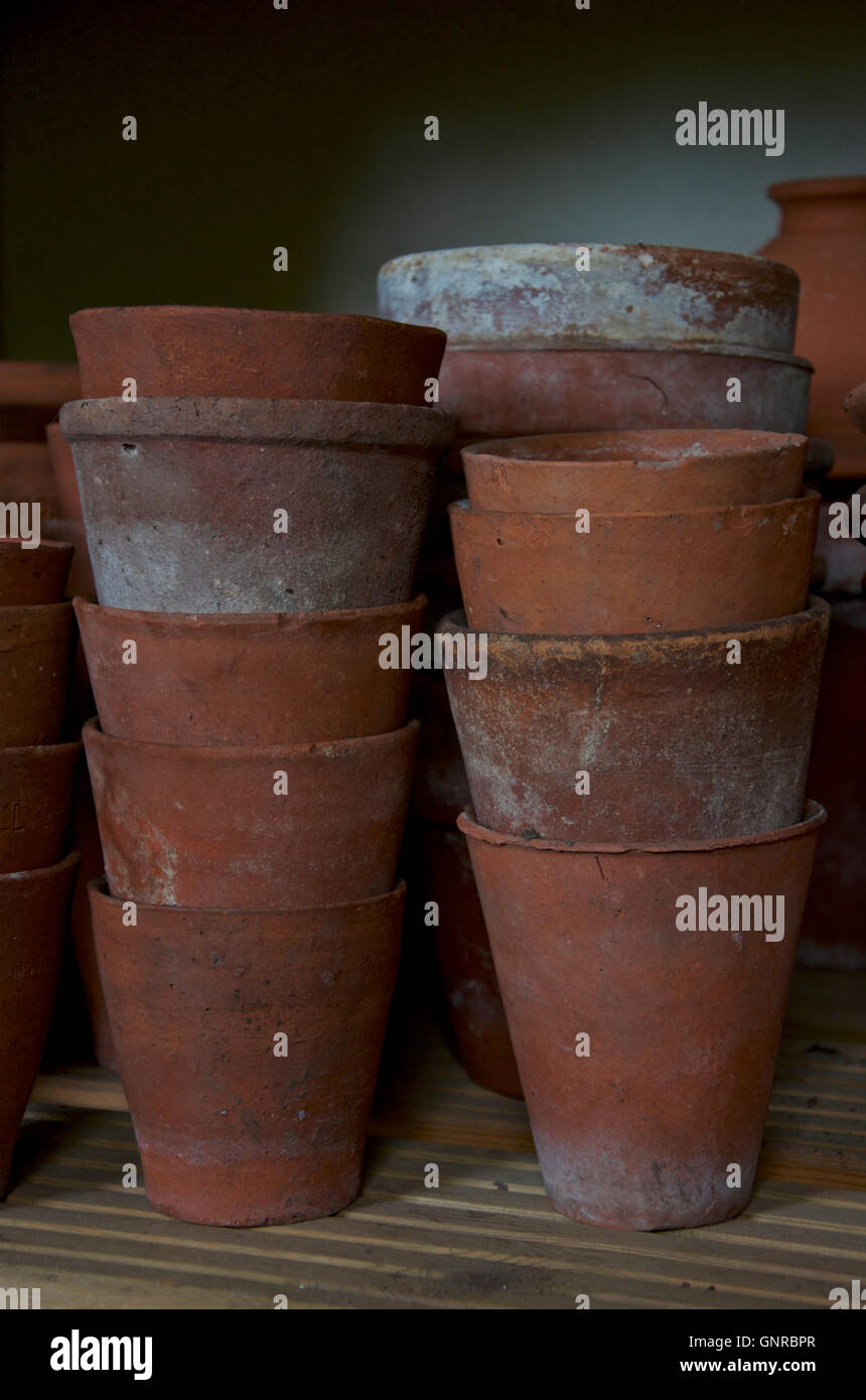Stack of old clay flower pots Stock Photo