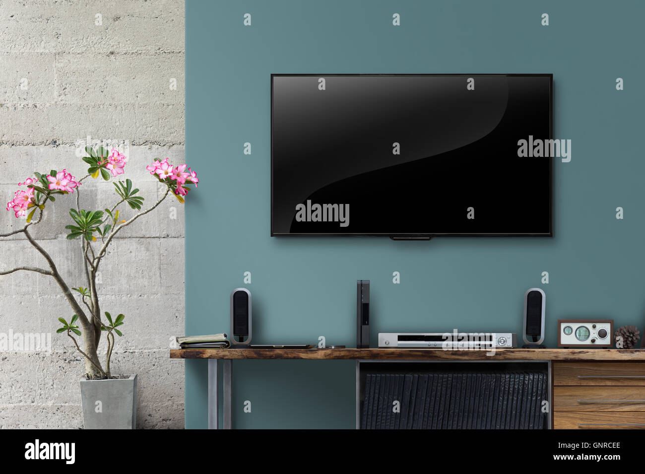 Led tv on concrete wall with wooden table in living room Stock Photo