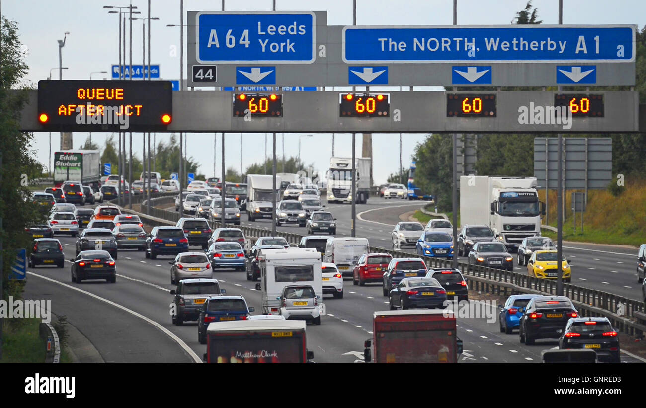 gantry lights flashing warning in traffic jam on the A1/M motorway Leeds Yorkshire UK Stock Photo