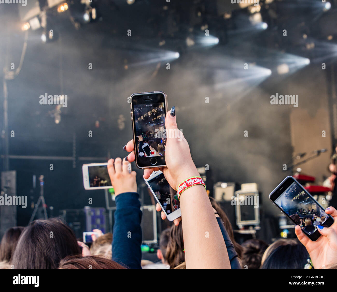 People at Festival No.6 Music Festival in Portmeirion Village, Gwynedd, Wales, UK using mobile phones to record performers. Stock Photo