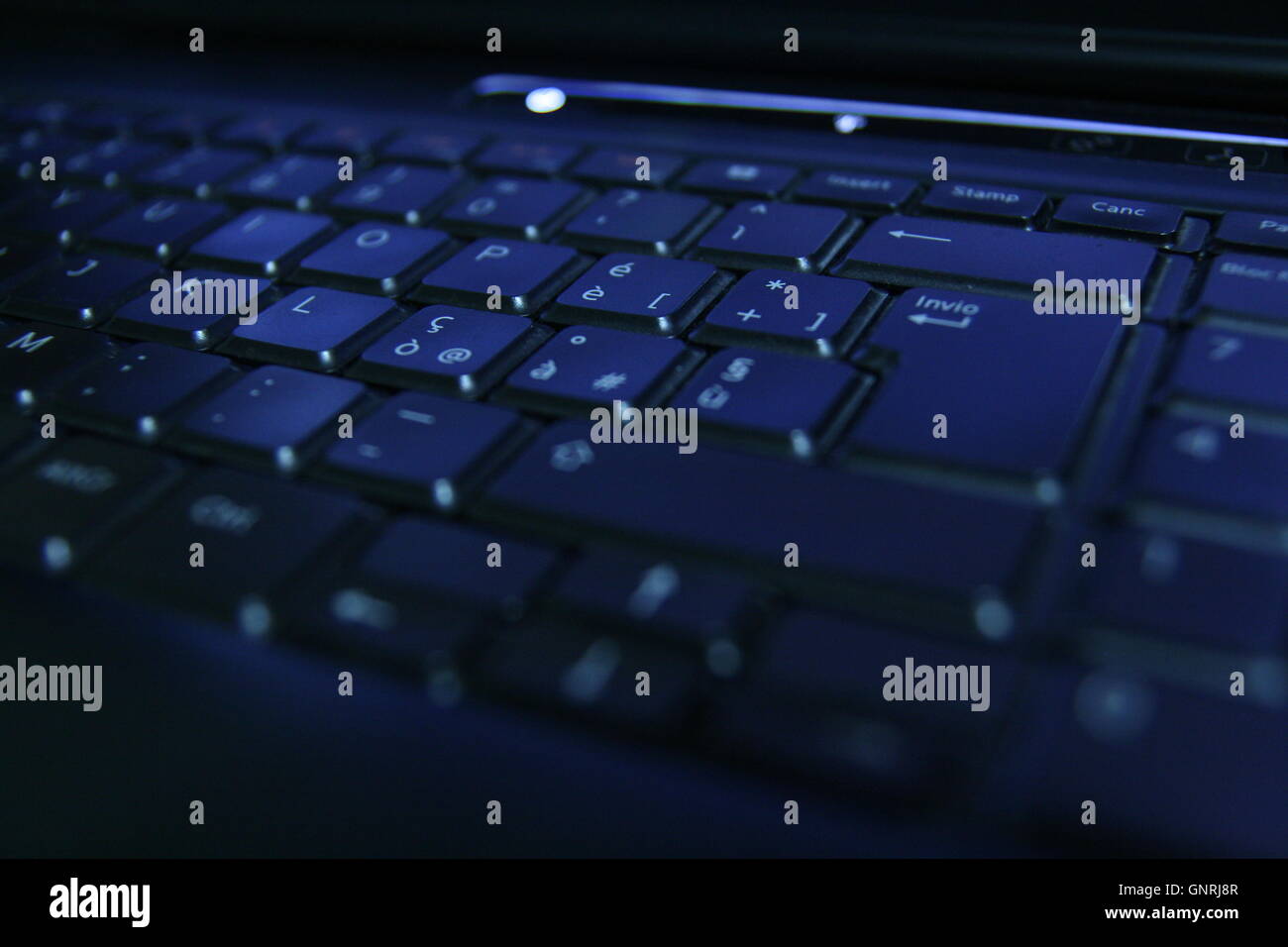 Blue-lit keyboard Stock Photo