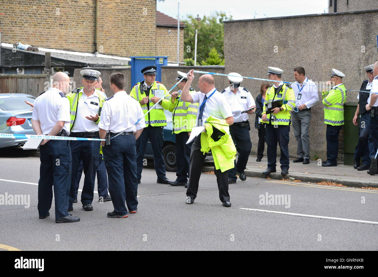 Police at the scene in Lennard Road, Penge in in south-east London after a car being chased by police has ploughed into a family leaving two people dead. Stock Photo