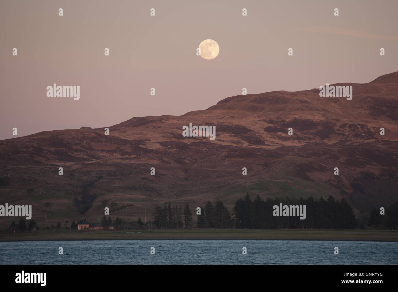 Tobermory, United Kingdom, full moon over the Isle of Mull in Scotland Stock Photo