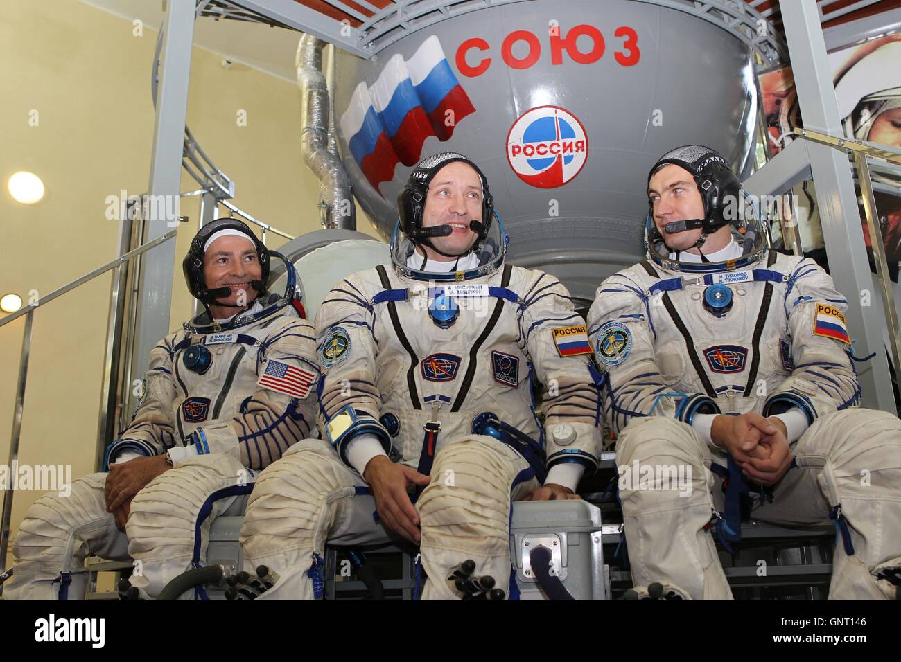 International Space Station Expedition 49-50 backup crew American astronaut Mark Vande Hei, left, and Russian cosmonauts Alexander Misurkin, center, and Nikolai Tikhonov answer reporters questions during final qualification exams at the Gagarin Cosmonaut Training Center August 30, 2016 at Star City, Russia. Stock Photo