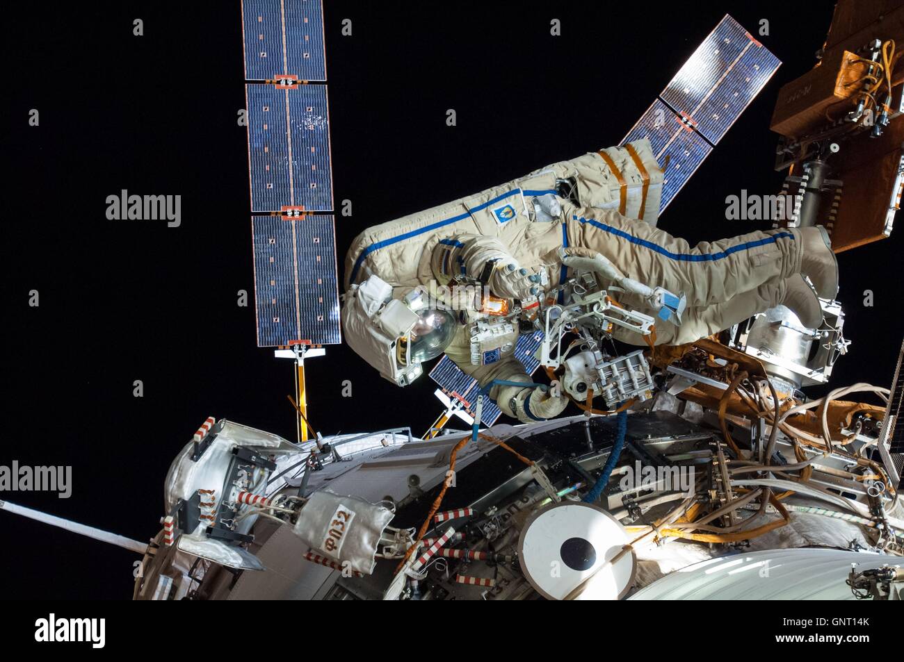 Russian cosmonaut Oleg Artemyev of International Space Station Expedition 40 during a spacewalk in his Russian Orlan spacesuit August 18, 2014 in Earth Orbit. Stock Photo