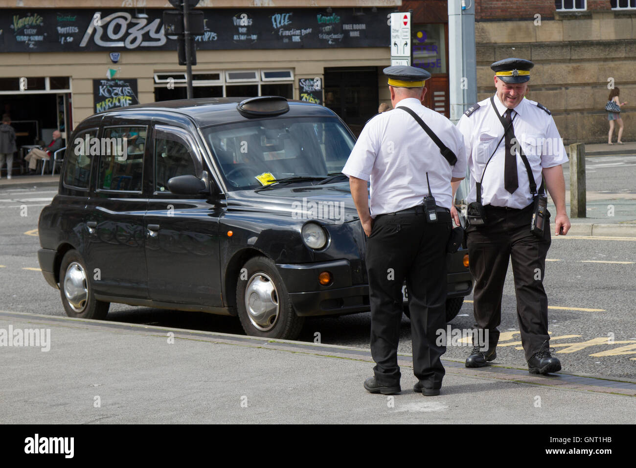 Black Cab given penalty notice by Traffic Wardens for a parking violation near Greater Williamson Square, Liverpool, Merseyside, UKK Stock Photo