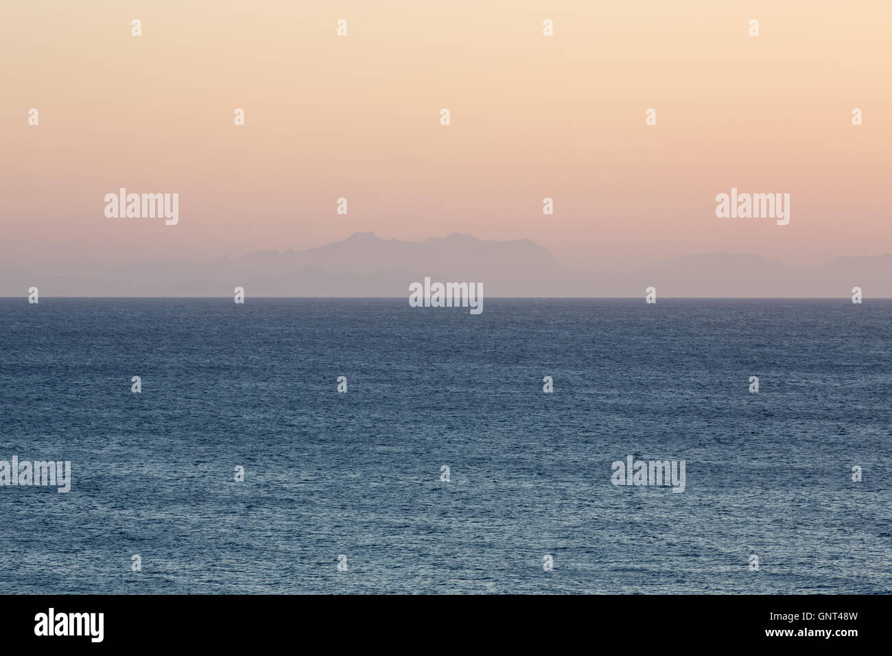 Panoramic view of the sea in Menorca with Mountain silhoettes of Majorca Stock Photo
