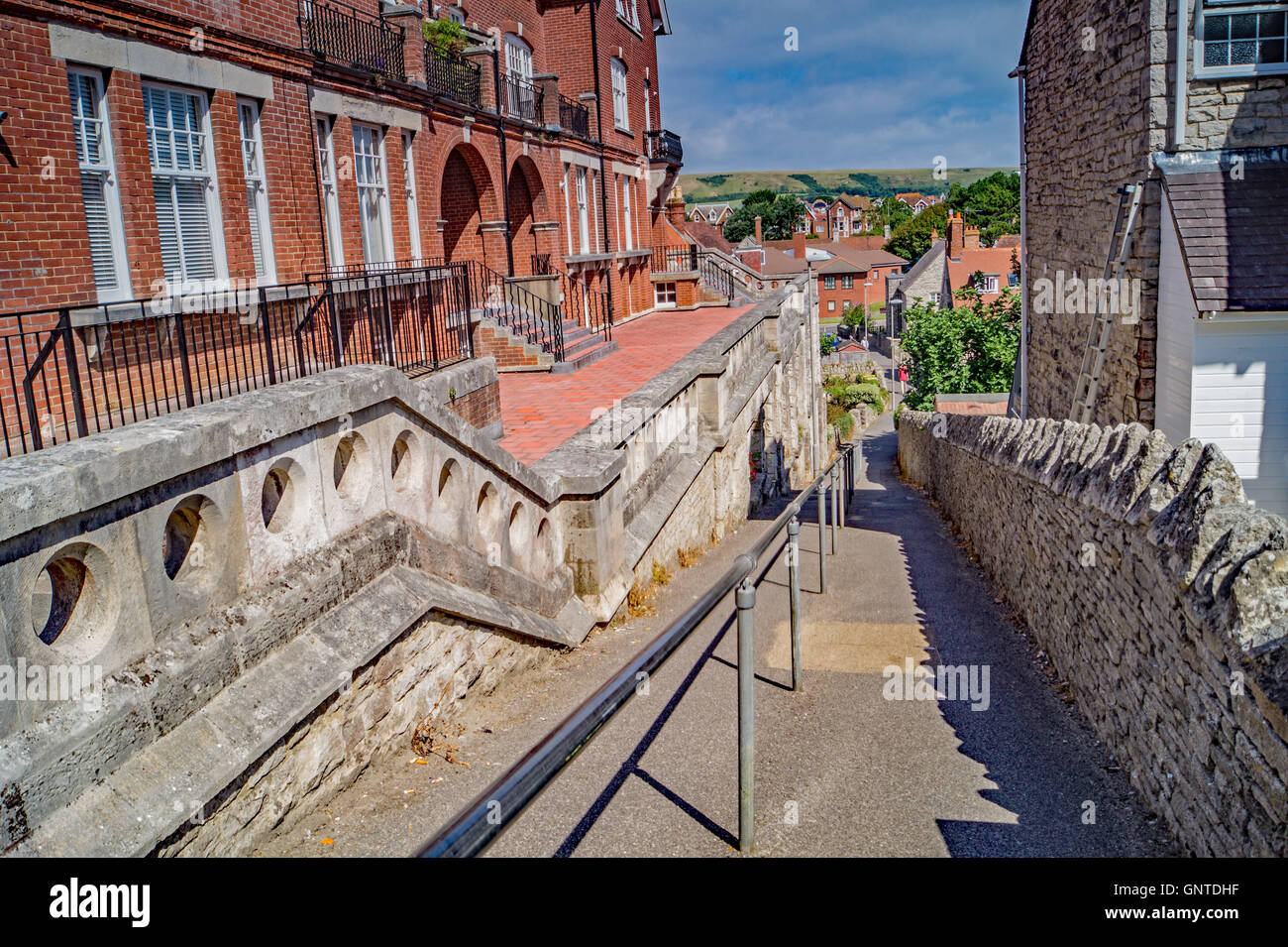 Up and Down the Alleyway. A view along the railings leading down the ...