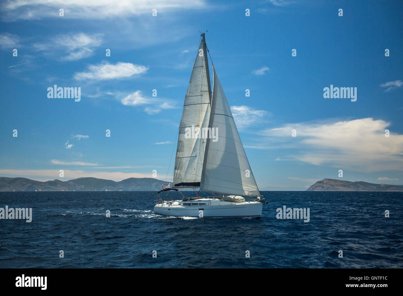 Sailing ship luxury yacht with white sails in the Aegean Sea Stock ...
