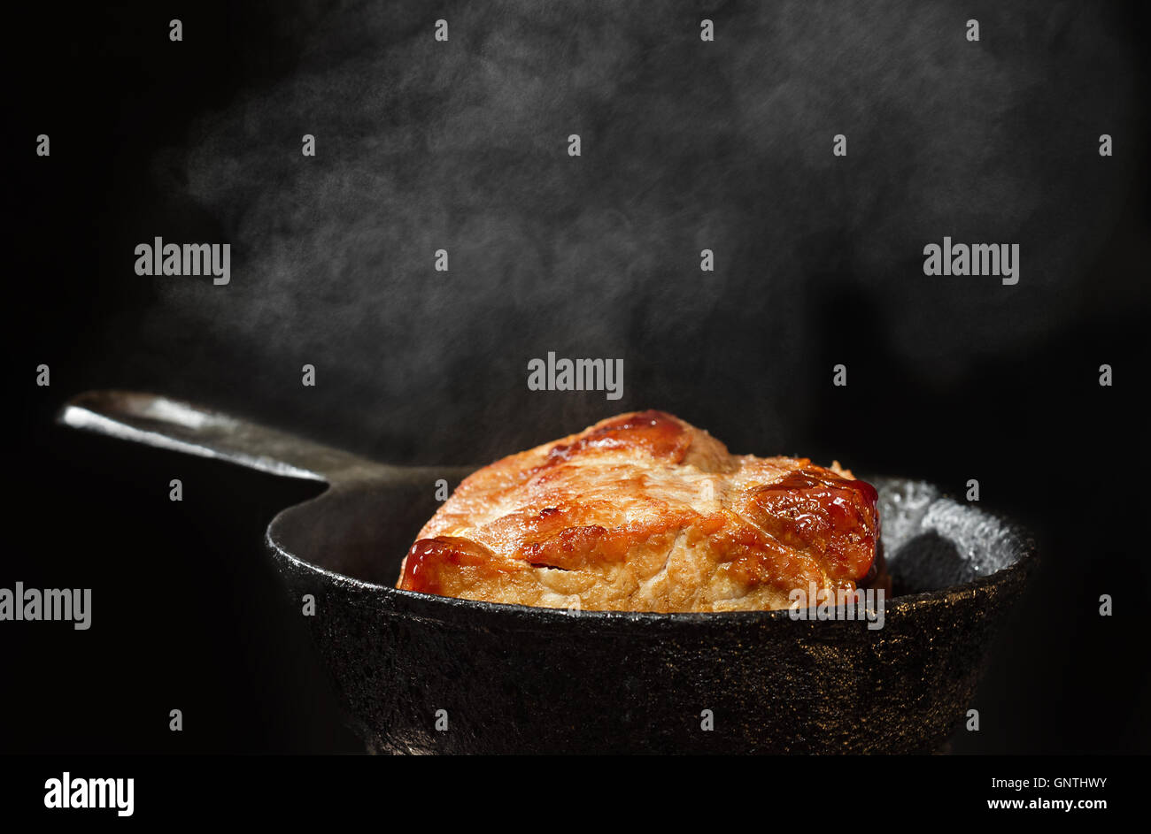 Pork roast in a castiron skillet Stock Photo Alamy