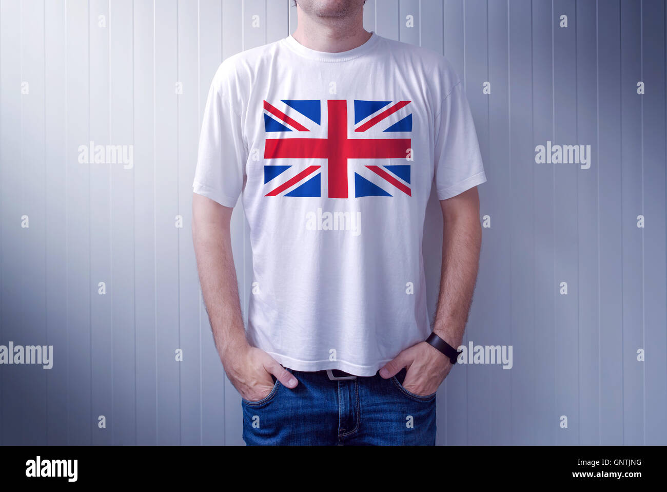Man wearing white shirt with United Kingdom flag print, adult male person supporting Great Britain Stock Photo