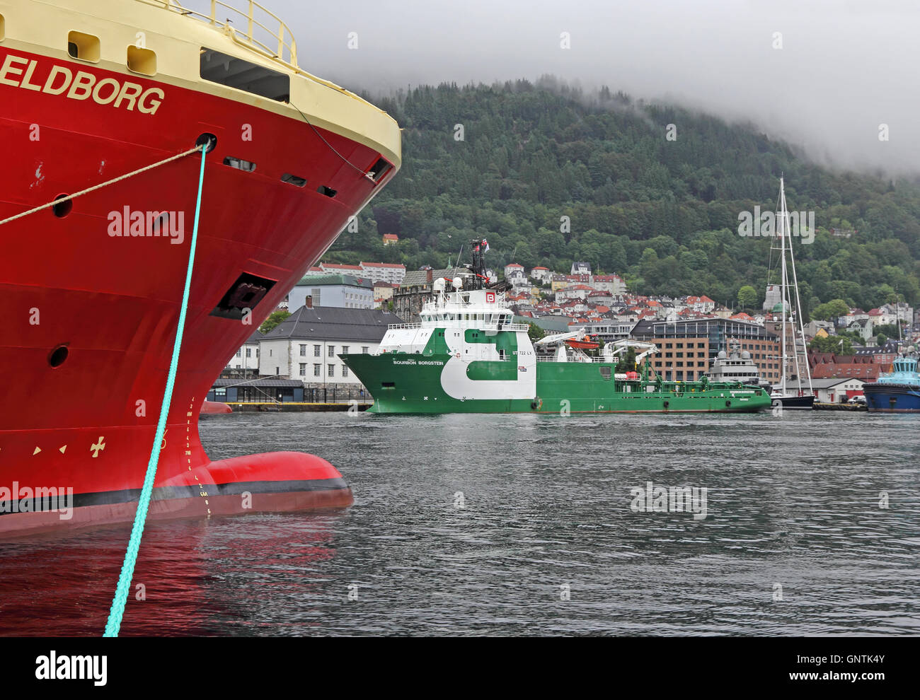 MV Elborg, a platform supply vessel, and MV Bourbon Borgstein, an anchor handling vessel, moored in port of Bergen, Norway Stock Photo