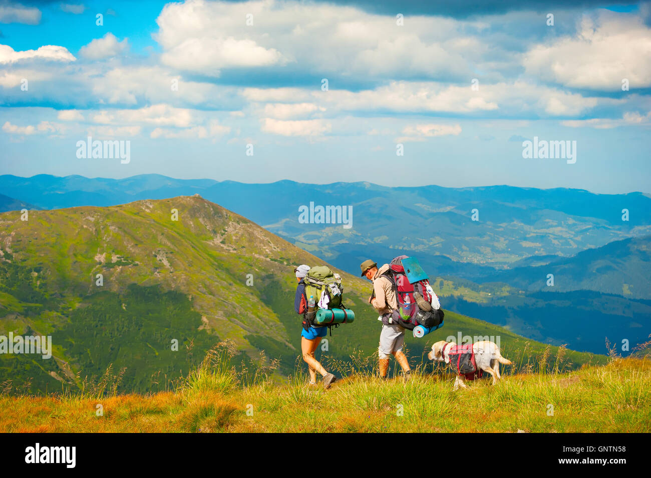 Man woman dog hiking mountain hi-res stock photography and images - Alamy