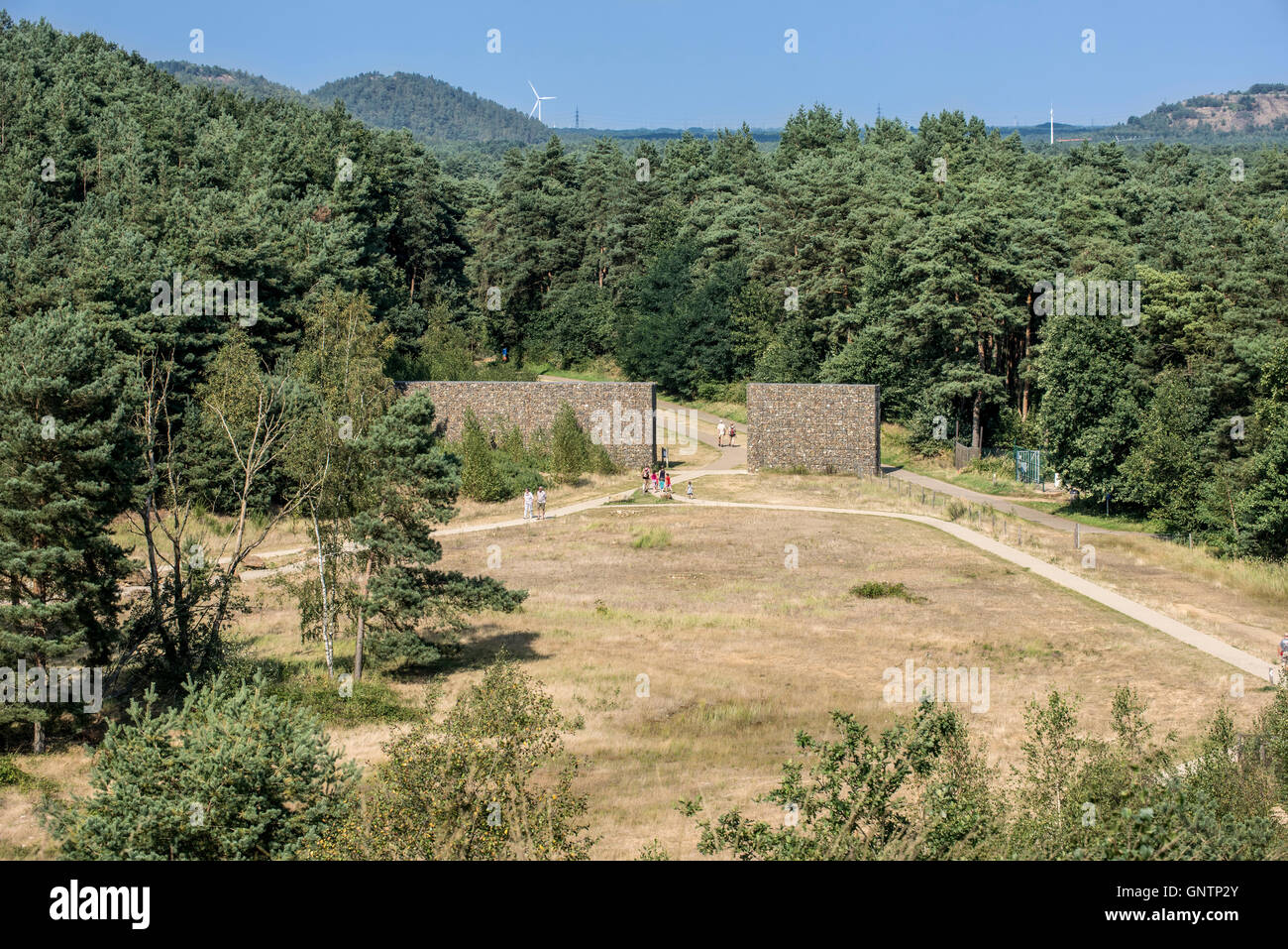 Tourists walking through entrance gate of the Mechelse Heide, heathland in the Hoge Kempen National Park, Limburg, Belgium Stock Photo