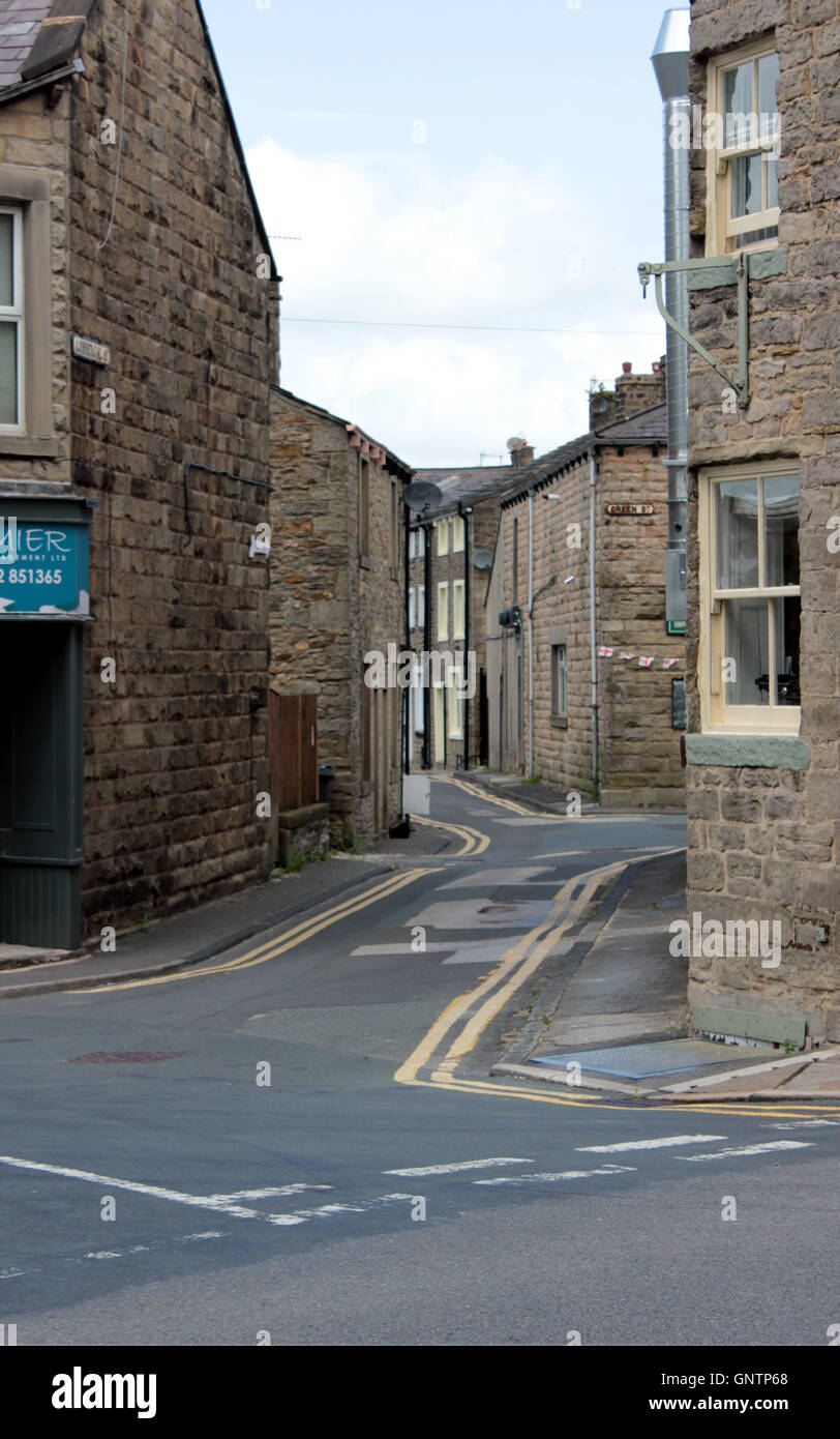 Looking down Commercial Street, with stone built terraced buildings in