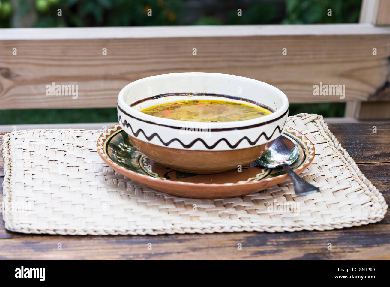 Traditional zama chicken soup plate with ornaments on a restaurant table in Moldova Stock Photo