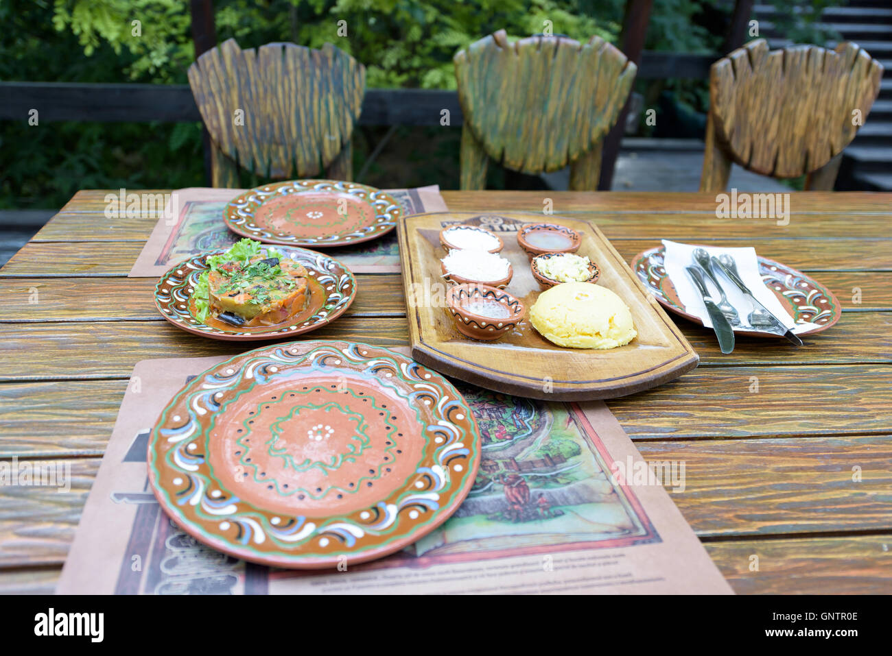 National food in traditional plates with ornaments on a restaurant table in Moldova Stock Photo