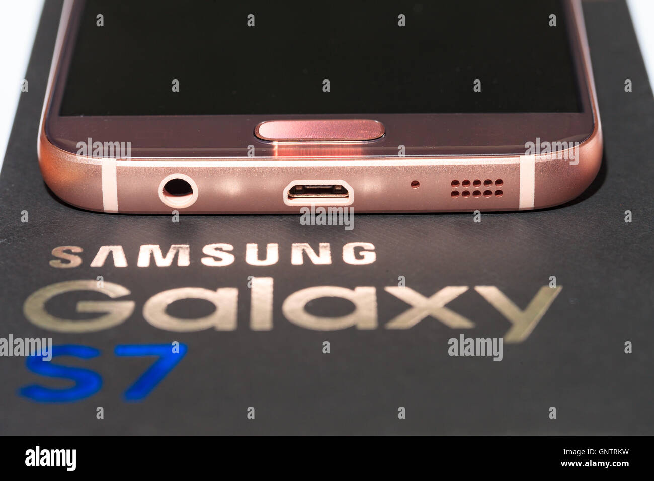 Rose gold colored Samsung Galaxy S7 mobile phone. Stock Photo