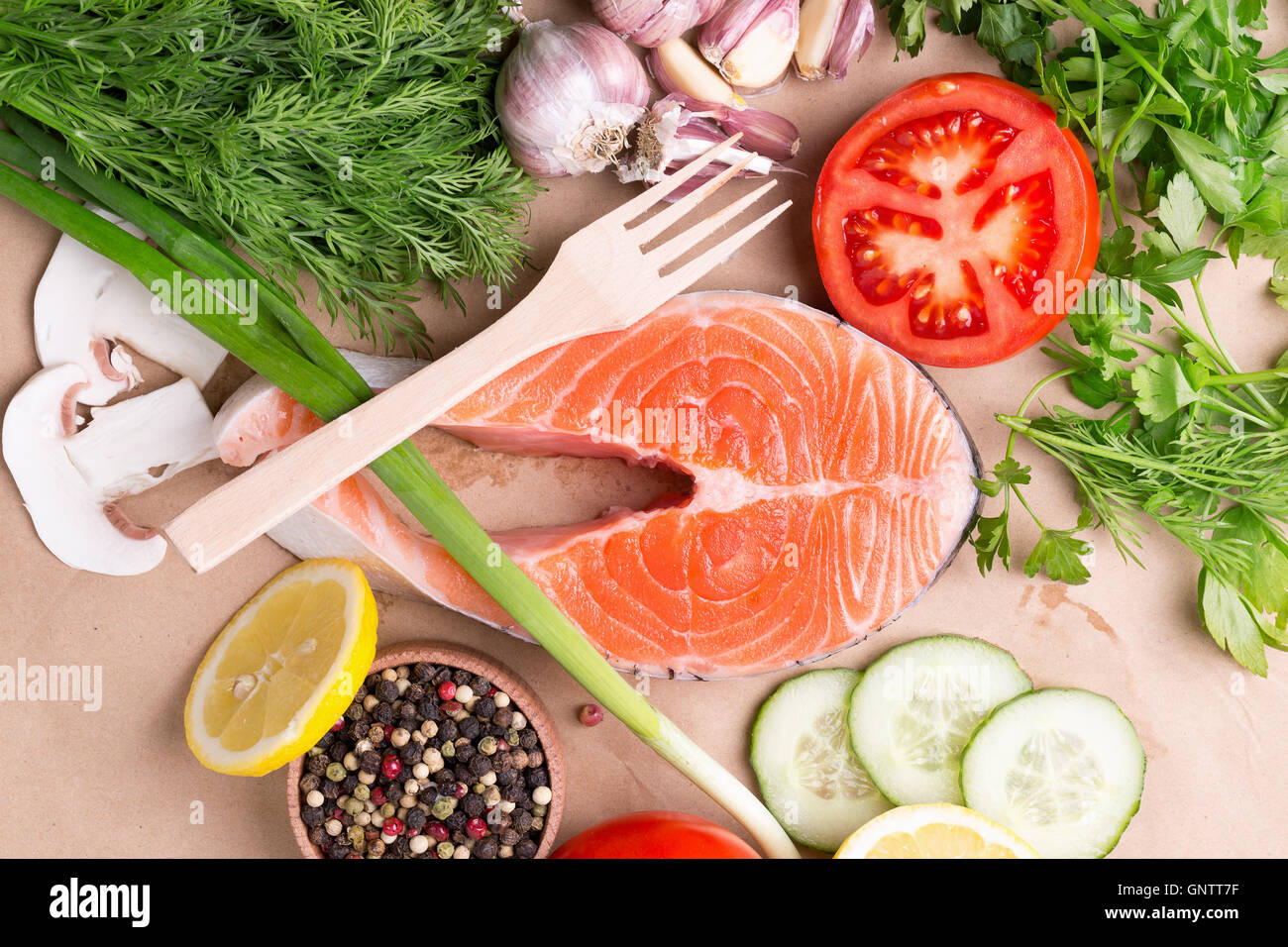 red fish steak with vegetables and spices. Stock Photo