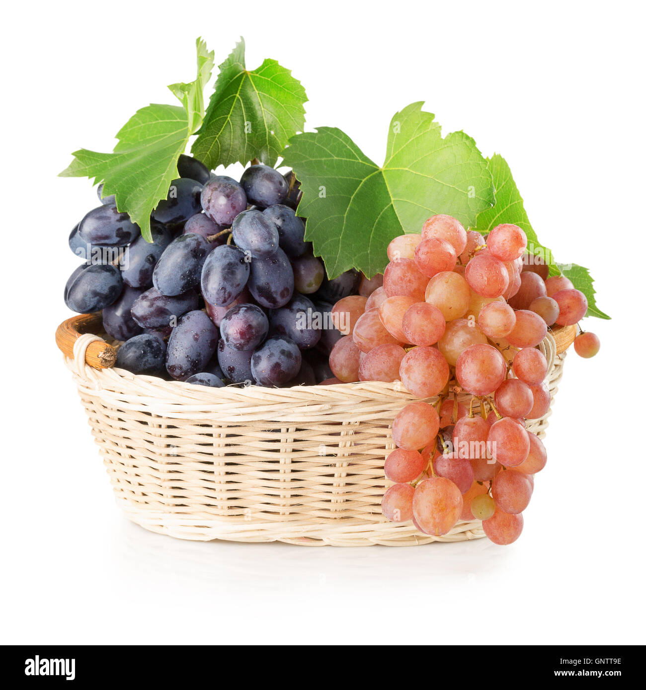 purple and pink grapes in basket isolated on the white background Stock ...