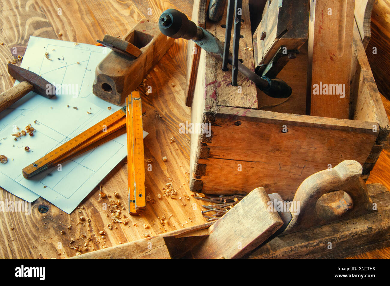 Equipment carpenter on a wooden desk with plans Stock Photo Alamy